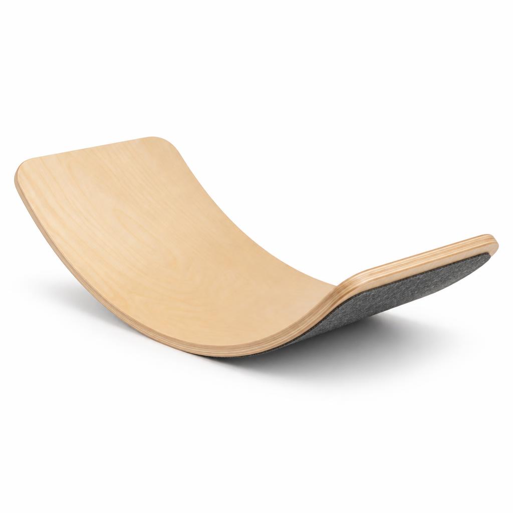 A curved birch toddler balance board on a white background
